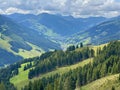 Aerial view on cozy hut with mountain panorama from Saalbach to Hinterglemm in the Alps in Austria on a sunny summer day Royalty Free Stock Photo