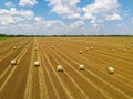 Aerial view of crop wheat rolls of straw in a field Royalty Free Stock Photo