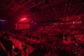 Crowd enjoying concert in illuminated red stadium Royalty Free Stock Photo