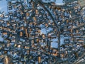 Aerial view of crowded town on snow covered landscape during winter Royalty Free Stock Photo