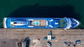 Aerial view cruise ship parking the pier, Cruise ship at harbor. Aerial view beautiful large white ship, Top view from drone of