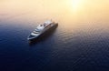 Aerial view on cruise ship during sunset. Adventure and travel. Landscape with cruise liner on Mediterranean sea. Luxury cruise. Royalty Free Stock Photo