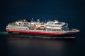 Aerial view of a cruiser sailing on a dark blue ocean surface, near Tromso in northern Norway