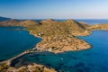 Aerial view of the crystal clear ocean and dry summer coastline of Kolokitha and Olous near Elounda, Crete, Greece Royalty Free Stock Photo