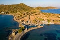 Aerial view of the crystal clear ocean and dry summer coastline of Kolokitha and Olous Royalty Free Stock Photo