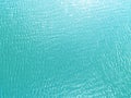 Aerial view of a Crystal clear sea water texture. View from above Natural blue background. Turquoise ripple water reflection in tr Royalty Free Stock Photo