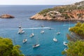 Aerial view of crystal clear turquoise water of bay Port Brut at Cala d`Hort with a few white sailing yachts. Ibiza, Balearic Royalty Free Stock Photo