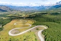 Aerial view of the curved asphalt road trough mountains. Carretera Austral road near the Cerro Castillo National Park. Chile