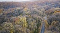 Aerial view of curvy road in forest. Autumn high in mountains Royalty Free Stock Photo