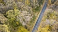 Aerial view of curvy road in forest. Autumn high in mountains Royalty Free Stock Photo