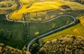 Aerial view of a curvy road through the Masurian landscape