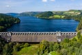 Aerial view of a dam wall and huge reservoir Royalty Free Stock Photo