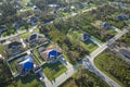 Aerial view of damaged in hurricane Ian house roof covered with blue protective tarp against rain water leaking until Royalty Free Stock Photo