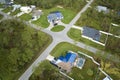 Aerial view of damaged in hurricane Ian house roof covered with blue protective tarp against rain water leaking until Royalty Free Stock Photo