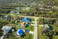 Aerial view of damaged in hurricane Ian house roof covered with blue protective tarp against rain water leaking until Royalty Free Stock Photo