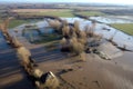 aerial view of a damaged levee with floodwater