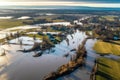 aerial view of a damaged levee with floodwater