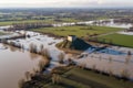 aerial view of a damaged levee with floodwater