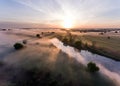 Aerial view of the dawn over the river in the fog Royalty Free Stock Photo