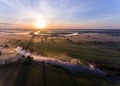 Aerial view of the dawn over the river in the fog Royalty Free Stock Photo