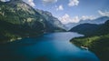 Aerial view of deep blue mountain lake in swiss alps, klontalersee switzerland Royalty Free Stock Photo