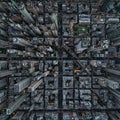 Aerial view of a densely built urban area displaying a grid-like street pattern.