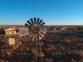 Aerial view of the derelict buildings and a windmill at the abandoned railway town called Putsonderwater, ghost town in South