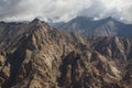 Aerial view of desert and high mountain from the airplane window. New Delhi-Leh flight ,India. Royalty Free Stock Photo