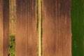 Aerial view of dirt road through agricultural field top down Royalty Free Stock Photo