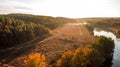 Aerial view of dirty road among the forest and trees. Sunset field in Ukraine Royalty Free Stock Photo