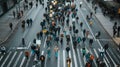 Aerial view of a diverse crowd protesting on a city street