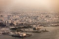 Aerial view of Doha, Qatar and harbor with haze and dust