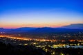 Aerial view at Doi Khao Kwai during blue zone after sunset. Mountain range as background with light tail on main road at Chiangrai