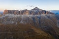 Aerial view of the Dolomites mountain range and Lake Fedaia during dawn. South Tyrol Italy in the fall.