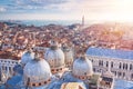 Aerial view of the domes of St Mark`s Basilica with the city view in Venice, Italy. San Giorgio maggiore church in the background Royalty Free Stock Photo