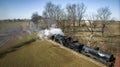 Aerial View of a Double Header Steam Freight Train, Blowing Lots of Smoke