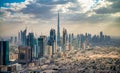Aerial view of Downtown Dubai and city outskirts at sunset, view from helicopter Royalty Free Stock Photo