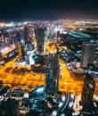 Aerial view of Downtown Dubai with roads, Dubai Mall and the fountain by night, from Burj Khalifa observatory deck in Royalty Free Stock Photo