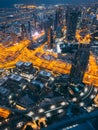 Aerial view of Downtown Dubai with roads, Dubai Mall and the fountain by night, from Burj Khalifa observatory deck in Royalty Free Stock Photo