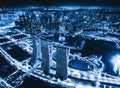 Aerial view of Downtown Singapore city in Marina Bay area. Financial district and skyscraper buildings at night