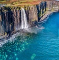 Aerial view of the dramatic coastline at the cliffs by Staffin with the famous Kilt Rock waterfall - Isle of Skye - Royalty Free Stock Photo