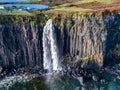 Aerial view of the dramatic coastline at the cliffs by Staffin with the famous Kilt Rock waterfall - Isle of Skye - Royalty Free Stock Photo