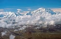 Aerial View of Dramatic Peaks Looming Out of the Clouds