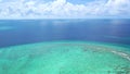 Aerial view with drone above coral reef in the exotic island of Maldives