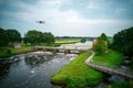 An aerial view with drone in the background above a weir in the river Vecht in the Netherlands. Downstream