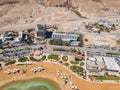 Aerial view from a drone of the beach on the Ein Bokek embankment on the coast of the Dead Sea and the sea itself, in Israel Royalty Free Stock Photo