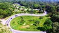 Aerial view from drone of cars are going through a curve road on the mountain Royalty Free Stock Photo
