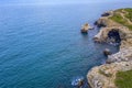 Aerial view from drone of coast with stone arch cliffs Royalty Free Stock Photo