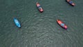 Aerial view from drone of Colorful long tail boats in the middle of the sea Royalty Free Stock Photo