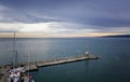 concrete water breaker, and small marina with boats and yachts